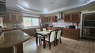 The kitchen has another dining-table