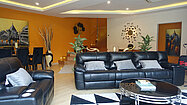 Another lounge area with TV and views across the pool