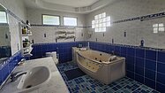 The master bathroom with a Jazuzzi tub