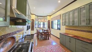 A noble kitchen with dining in the background