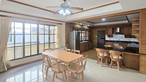 Kitchen, breakfast bar and dining-area