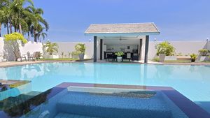 The blue of the pool and the Jacuzzi