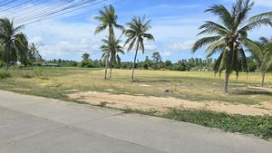 The concrete road alongside the land