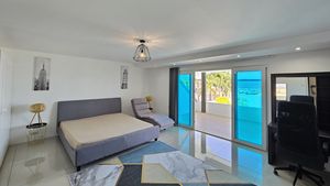 The master-bedroom facing a large balcony